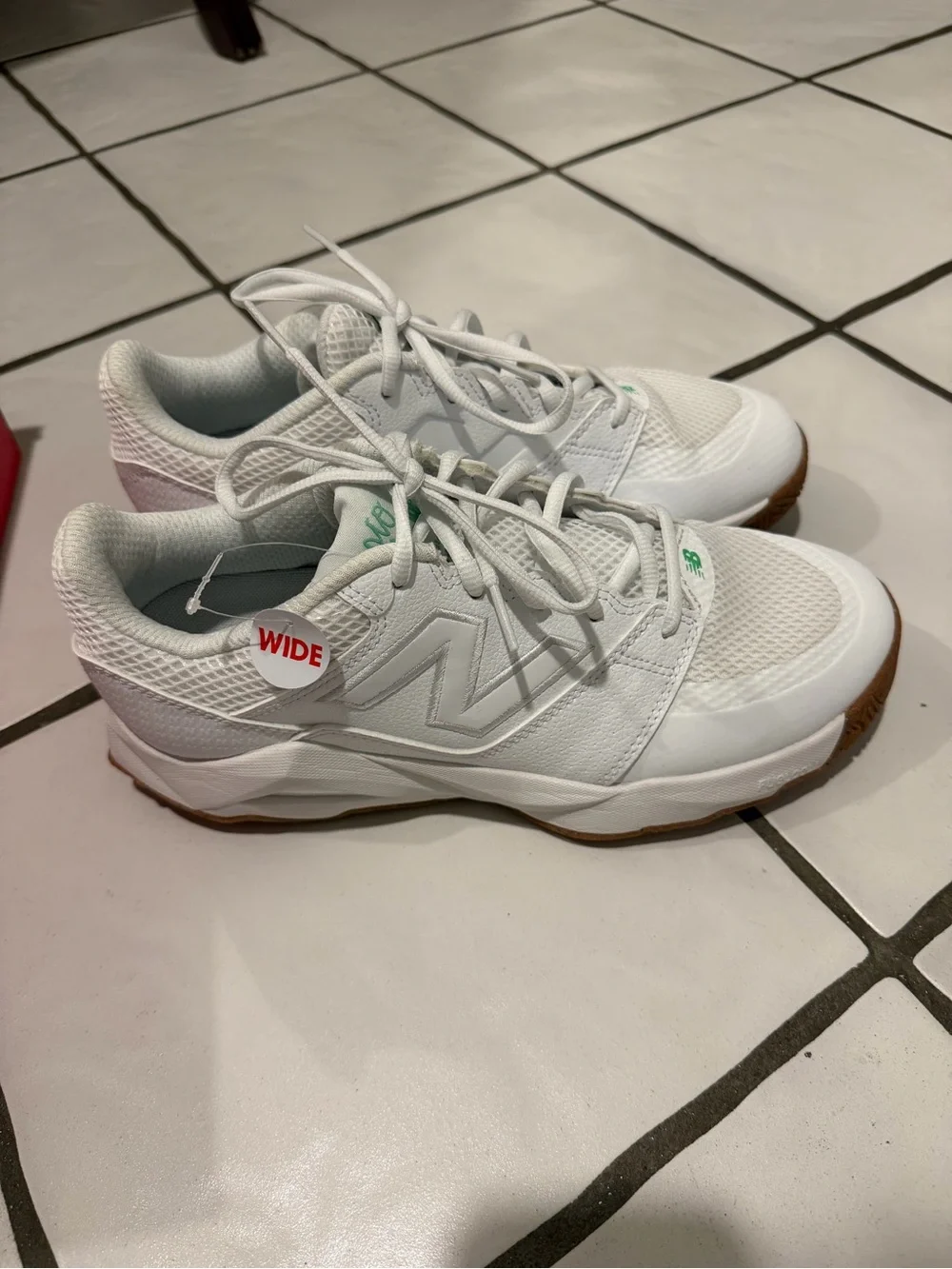 New Balance White Athletic Sneakers with Green Accents and Gum Outsole